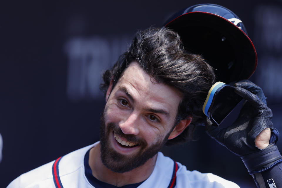 Atlanta Braves 'Dansby Swanson reacts in the dugout after hitting a leadoff home run in the first inning of a baseball game against the San Francisco Giants, Thursday, June 23, 2022, in Atlanta. (AP Photo/Todd Kirkland)