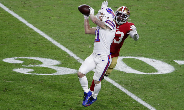 Bills wide receiver Cole Beasley makes a catch in front of a defender.