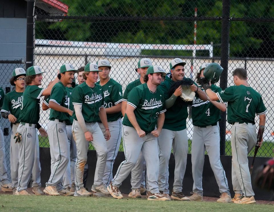 Flagler Palm Coast celebrates after scoring a run during the Five Star Conference finals against Pine Ridge at Spruce Creek High School in Port Orange, Thursday, April 18, 2024.