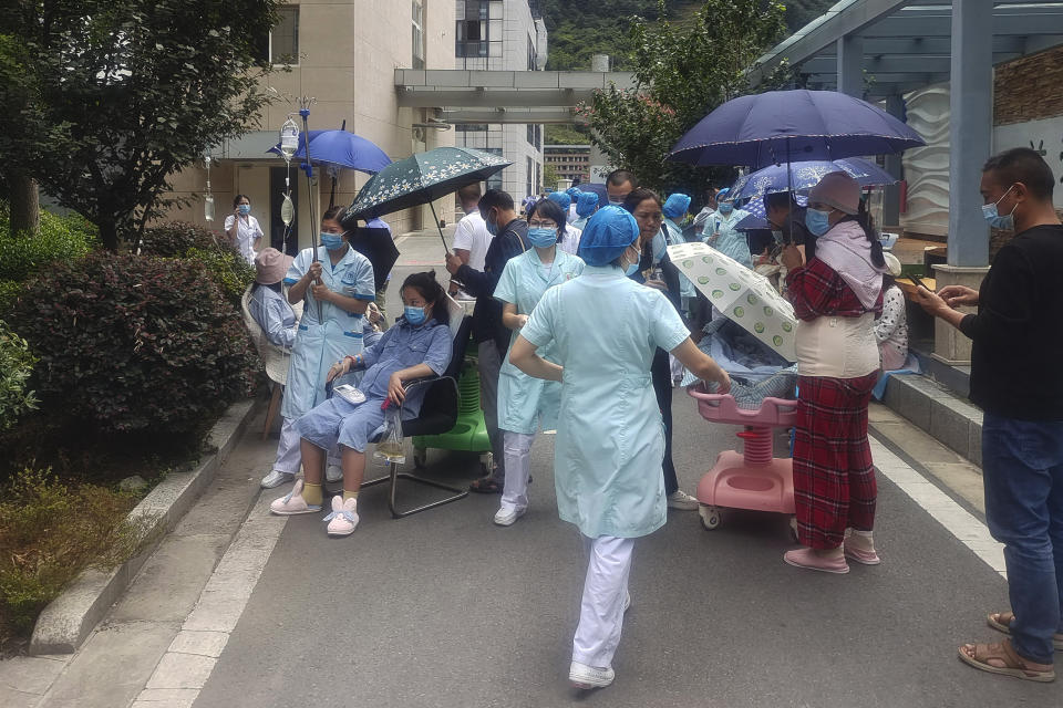 In this photo released by Xinhua News Agency, medical workers transfer patients to safe area at Renmin Hospital of Shimian County in Ya'an City, in the aftermath of an earthquake in southwestern China's Sichuan Province, Monday Sept. 5, 2022. Many people were reported killed in a 6.8 magnitude earthquake that shook China's southwestern province of Sichuan on Monday, triggering landslides and shaking buildings in the provincial capital of Chengdu, whose 21 million residents are already under a COVID-19 lockdown. (Xinhua via AP)