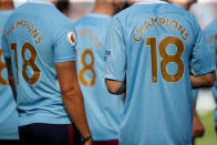 <p>Soccer Football – Premier League – Manchester City vs Huddersfield Town – Etihad Stadium, Manchester, Britain – May 6, 2018 The shirts of Manchester City players and staff as they celebrate winning the premier league title Action Images via Reuters/Carl Recine EDITORIAL USE ONLY. No use with unauthorized audio, video, data, fixture lists, club/league logos or “live” services. Online in-match use limited to 75 images, no video emulation. No use in betting, games or single club/league/player publications. Please contact your account representative for further details. </p>