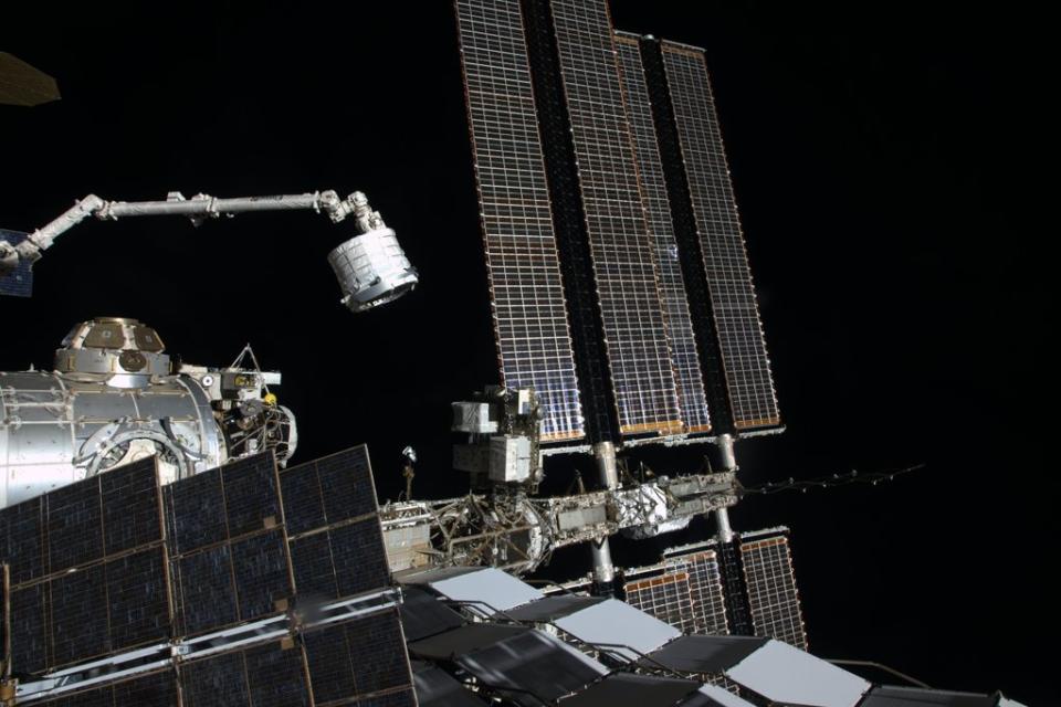 The Bigelow Expandable Activity Module, an inflatable space room built by Bigelow Aerospace, is moved by robotic arm to its new home on the International Space Station on April 16, 2016 in this exterior camera view. BEAM
