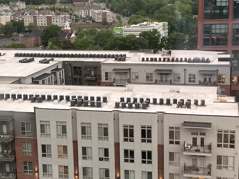 The view of hundreds of rooftop air conditioners, as seen from the seventh floor of the Durham County Courthouse