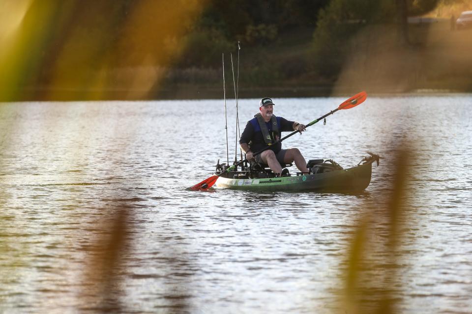 Kenny Ratliff paddles at a park in Louisville on Oct. 13, 2022. Ratliff lost his father and brother when they drowned in a low-head dam accident in 1997 in northcentral Kentucky.