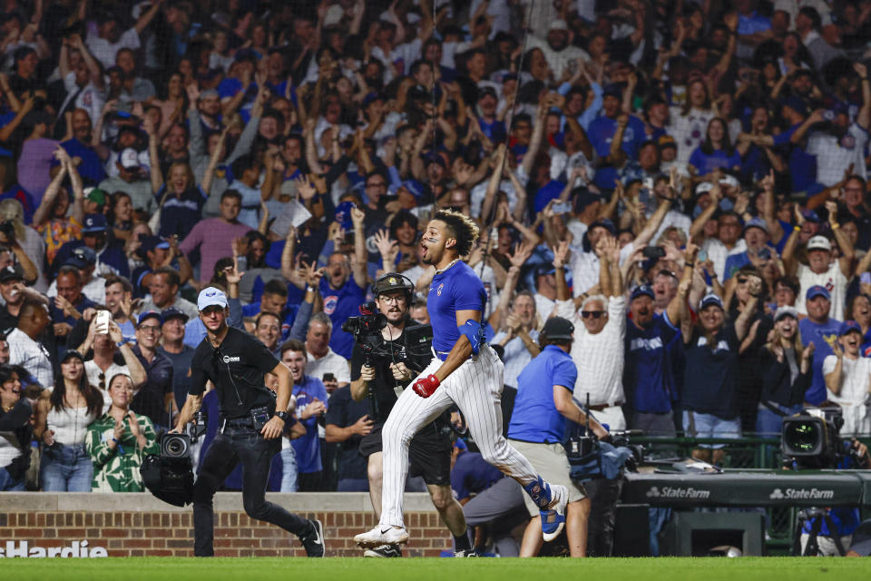 Aug 16, 2023; Chicago, Illinois, USA; Chicago Cubs second baseman Christopher Morel (5) celebrates as he rounds the bases after hitting a three-run walk-off home run against the Chicago White Sox during the ninth inning at Wrigley Field. Mandatory Credit: Kamil Krzaczynski-USA TODAY Sports