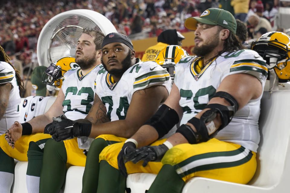 Green Bay Packers center Corey Linsley, from left, sits on the bench with offensive guard Elgton Jenkins and offensive tackle David Bakhtiari during the second half of the NFL NFC Championship football game against the San Francisco 49ers Sunday, Jan. 19, 2020, in Santa Clara, Calif. The 49ers won 37-20 to advance to Super Bowl 54 against the Kansas City Chiefs. (AP Photo/Tony Avelar)