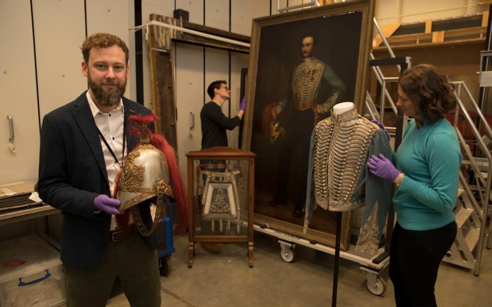 Chris Cooper (L), curator at the National Army Museum, with John Grant Malcolmson's helmet and pieces of his ceremonial uniform - Copyright ©Heathcliff O'Malley , All Rights Reserved, not to be published in any format without pri