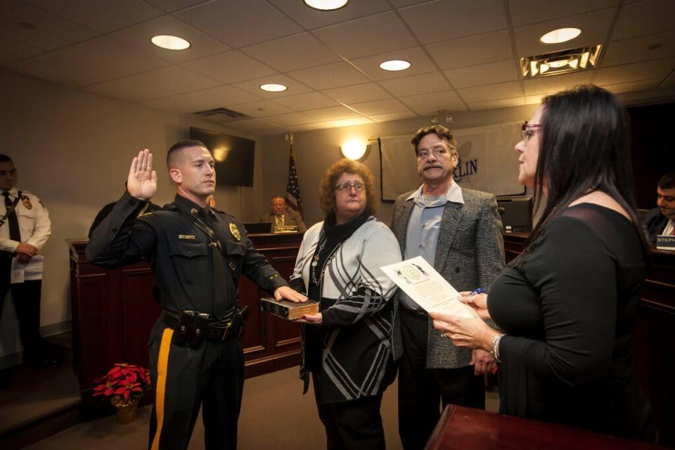 Franklin Borough Police Sgt.  William Grissom takes the oath of office as he is promoted from patrolman to sergeant at the borough's reorganization meeting on January 1, 2019.