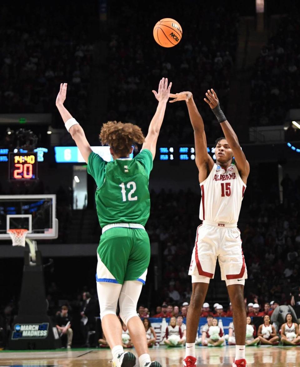 Alabama forward Noah Clowney (15) shoots a three over Texas A&M Corpus Christi forward Owen Dease (12) in the first round of the NCAA Tournament on March 16, 2023, at Legacy Arena in Birmingham, Alabama. Gary Cosby Jr./USA TODAY NETWORK