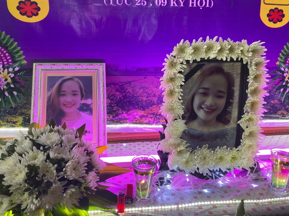 Portraits of Bui Thi Nhung are displayed in a shrine put up at the family home on Saturday, Nov. 30, 2019 in the village of Do Thanh, Vietnam. The body of 19-year old Nhung was among the last remains of the 39 Vietnamese who died while being smuggled in a truck to England last month that were repatriated to their home country on Saturday. (AP Photo/Hau Dinh)