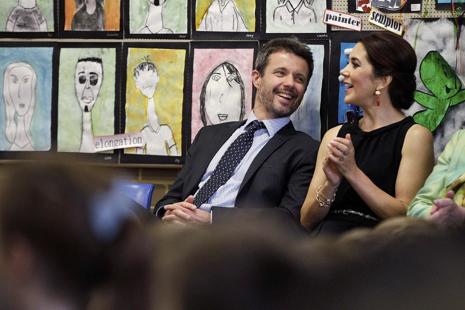 FILE - Denmark's Crown Prince Frederik, left, and Crown Princess Mary smile as they attend the Premier's Reading Challenge at Five Dock primary school Friday, Oct. 25, 2013 in Sydney, Australia. As a teenager, Crown Prince Frederik felt uncomfortable being in the spotlight, and pondered whether there was any way he could avoid becoming king. All doubts have been swept aside as the 55-year-old takes over the crown on Sunday, Jan. 14, 2024 from his mother, Queen Margrethe II, who is breaking with centuries of Danish royal tradition and retiring after a 52-year reign. (Brendon Thorne, Pool via AP, File)