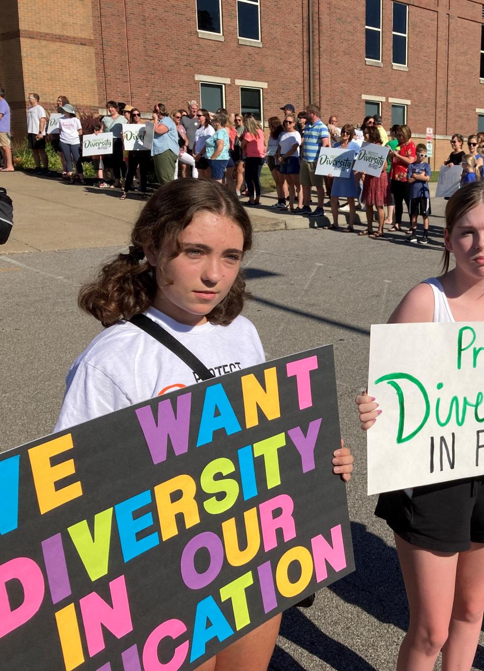 Anna Elfers, 16, is part of a protest outside of a Forest Hills School Board meeting at Nagel Middle School on June 29, 2022. Elfers says she wants to learn about diversity in school and is against recent policies imposed by board members.