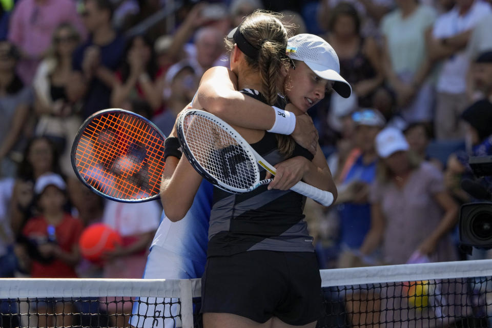 Iga Swiatek, of Poland, hugs Kaja Juvan, of Slovenia, after defeating Juvan in the third round of the U.S. Open tennis championships, Friday, Sept. 1, 2023, in New York. (AP Photo/Mary Altaffer)