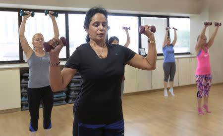 Dr. Anu Puttagunta, endocrinologist, participates with hospital staff in a MOVE exercise class at Saint Joseph Mercy hospital in Ypsilanti, Michigan, U.S., August 23, 2017. Picture taken August 23, 2017. REUTERS/Rebecca Cook