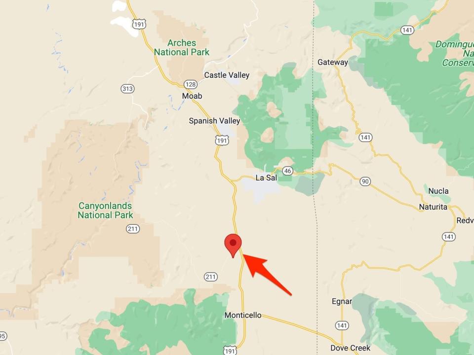 As arrow points to the Home of Truth ghost town in relation to Canyon Lands National Park and Moab, Utah.