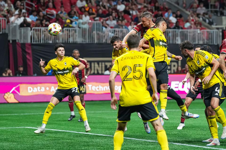 Jul 20, 2024; Atlanta, Georgia, USA; Atlanta United defender Stian Gregersen (5) puts in a header for his second goal of the match against the Columbus Crew during the second half at Mercedes-Benz Stadium. Mandatory Credit: Dale Zanine-USA TODAY Sports