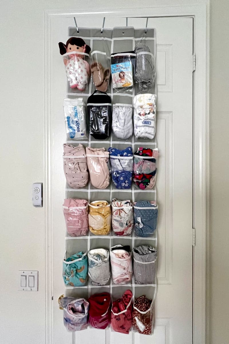 Simple Houseware hanging shoe organizer used to pack children's clothes.