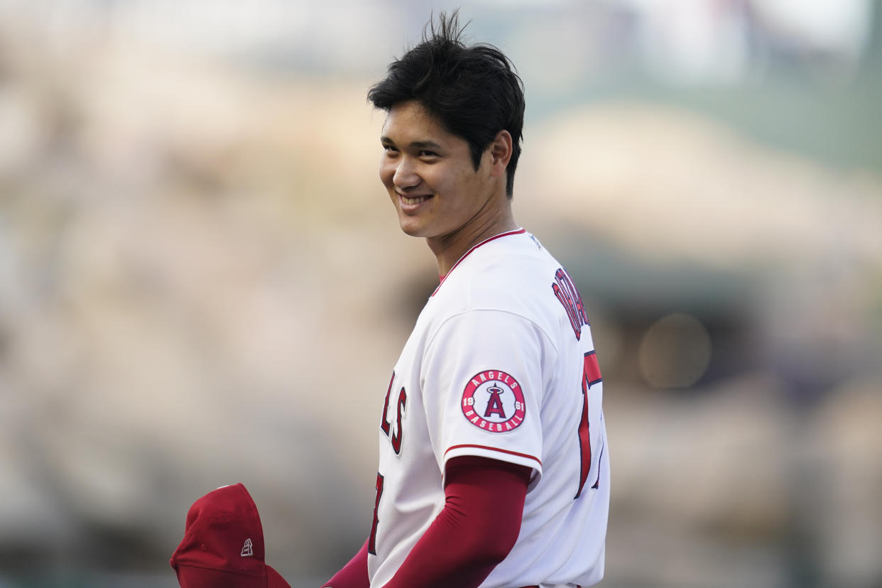 Los Angeles Angels designated hitter Shohei Ohtani (17) smiles before a baseball game against the Boston Red Sox in Anaheim, Calif., Wednesday, June 8, 2022. (AP Photo/Ashley Landis)