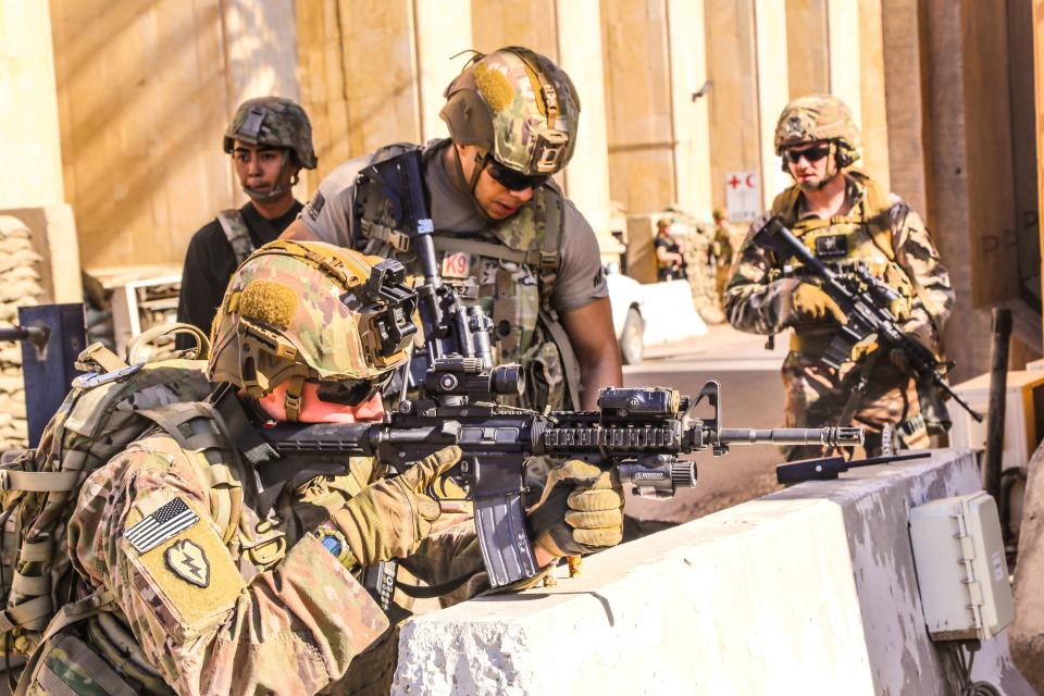 FILE PHOTO: U.S. Army soldiers from 1st Brigade, 25th Infantry Division, Task Force-Iraq, man a defensive position at Forward Operating Base Union III in Baghdad, Iraq, December 31, 2019. U.S. Army/Staff Sgt. Desmond Cassell/Task Force-Iraq Public Affairs/Handout via REUTERS