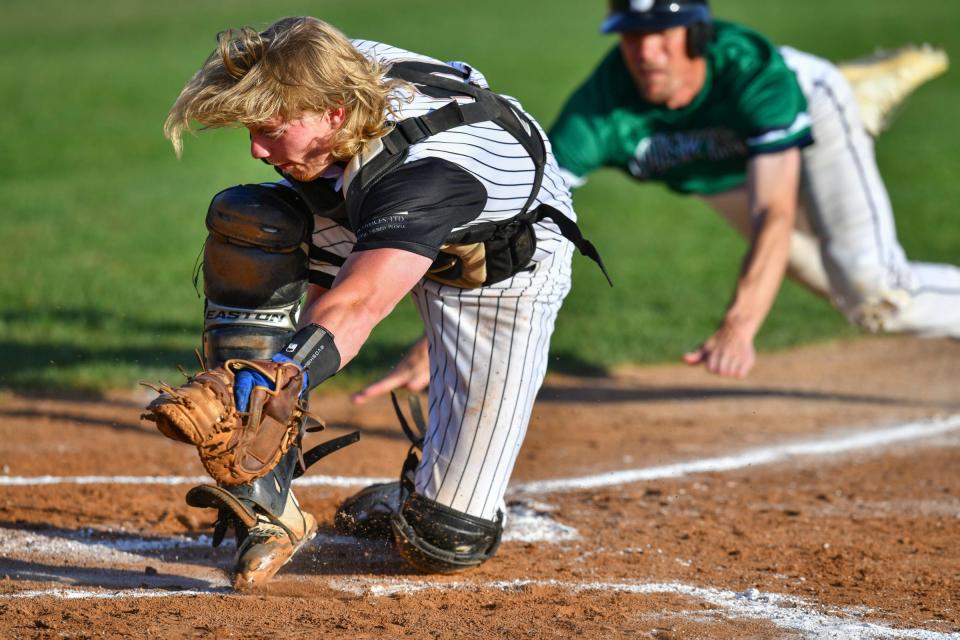 Stone Poneys catcher Will Kranz pivots to make the tag on Muskies baserunner Brian Schellinger at the plate  during the game Wednesday, June 29, 2022, at St. Cloud Orthopedics Field in Sartell. 