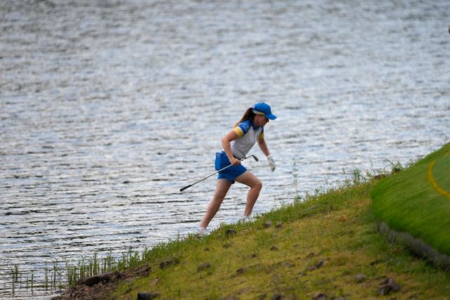 Leona Maguire walks up a steep bank