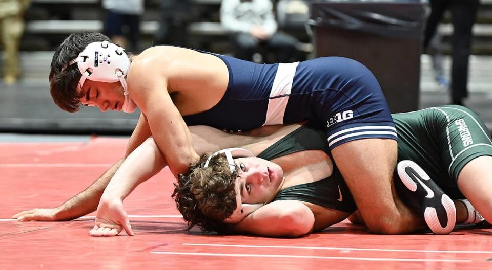 Penn State’s Aaron Nagao scores nearfall points on Michigan State’s Andrew Hampton in their 133-pound quarterfinals match of the Black Knight Invite on Sunday inside Christl Arena at West Point, N.Y. Nagao, who was making his Nittany Lions debut, beat Hampton, 13-1. Jennie Tate/For the CDT