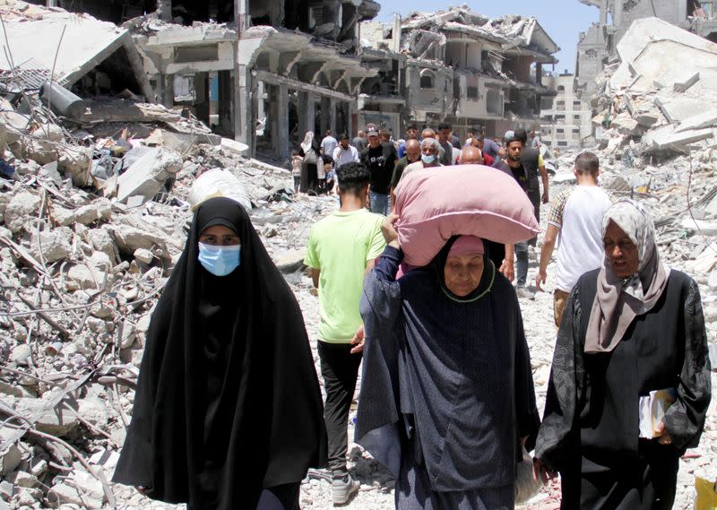 Palestinians inspect the damage after Israeli forces withdrew from Jabalia refugee camp