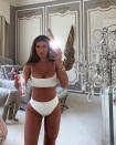 While promoting Loving Tan's natural self-tanner in an Instagram post, the brunette beauty slayed in a sleek white two-piece that really accentuated her curves.