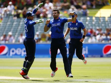 England's bowler James Anderson celebrates the first wicket of Bangladesh's batsman Imrul Kayes, with wicket keeper Jos Buttler (L) during their Cricket World Cup match in Adelaide, March 9, 2015. REUTERS/David Gray