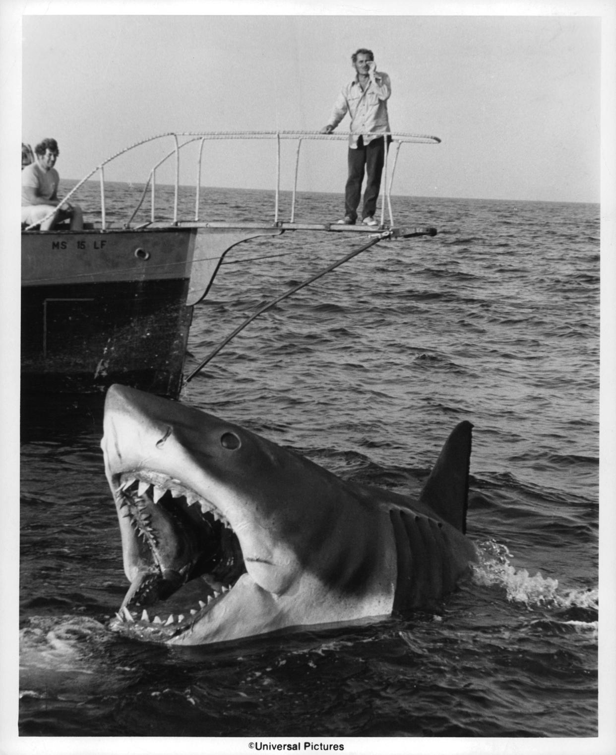 Robert Shaw stands over Jaws in a scene from the film 'Jaws', 1975. (Photo by Universal Pictures/Getty Images)