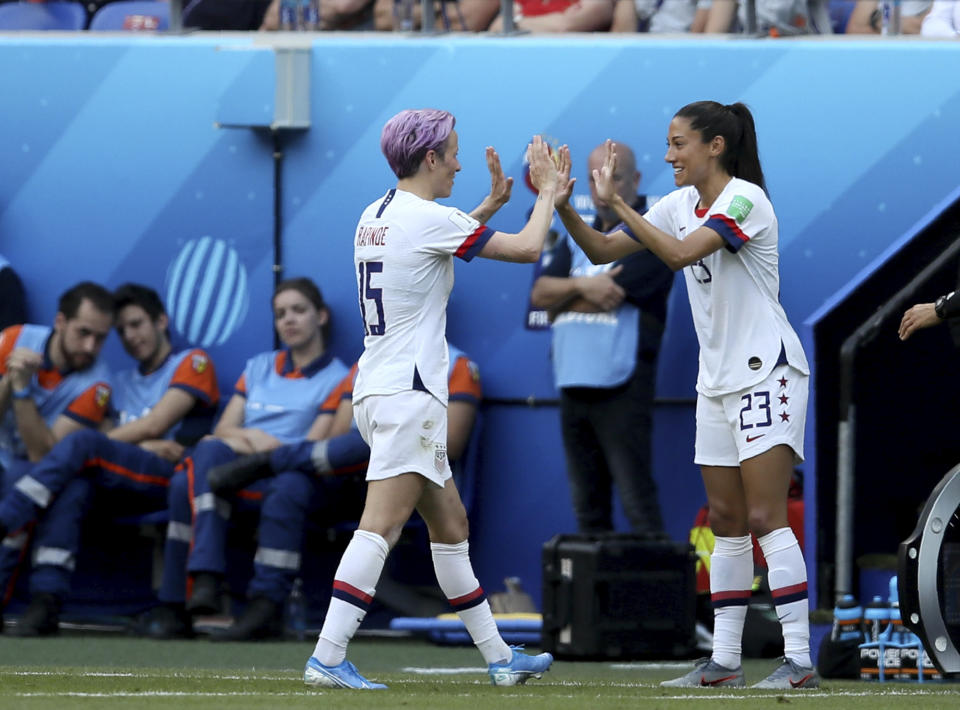 United States' Megan Rapinoe, left, is replaced by United States' Christen Press during the Women's World Cup final soccer match between US and The Netherlands at the Stade de Lyon in Decines, outside Lyon, France, Sunday, July 7, 2019. (AP Photo/David Vincent)