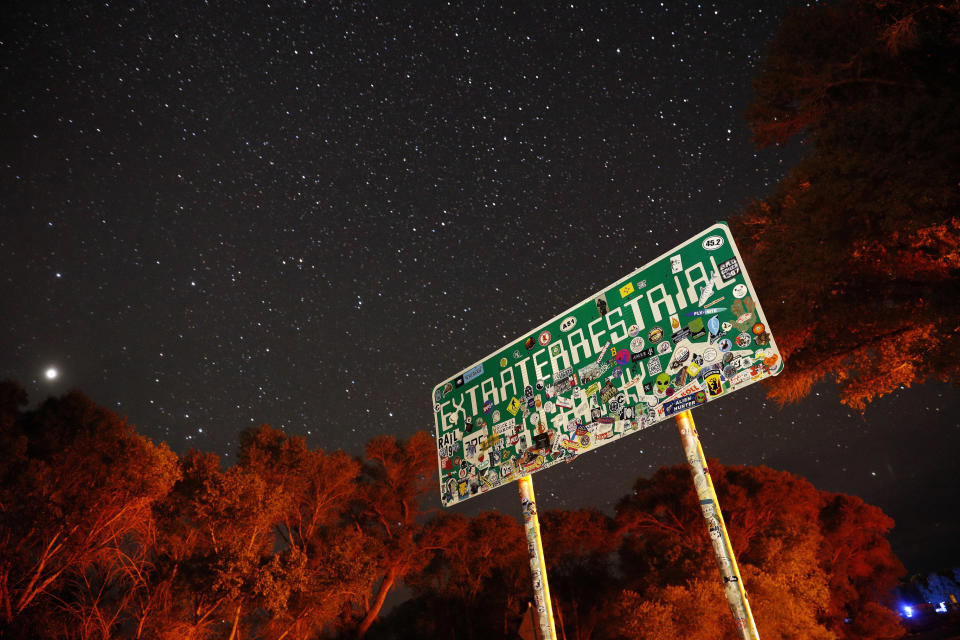 FILE - In this July 22, 2019 file photo, a sign advertises state route 375 as the Extraterrestrial Highway, in Crystal Springs, Nev., on the way to Nevada Test and Training Range near Area 51. A second rural Nevada county prepared Thursday for a "Storm Area 51" event that began as an internet joke but has drawn millions of social media fans. Organizers of the event hope people will gather and try to make their way into the once top-secret U.S. Air Force test area known in popular lore as a site for government studies of outer space aliens. An emergency declaration for Nye County took effect a day after county disaster preparation and sheriff officials told county lawmakers they're unsure how many — or where — people might show up for events Sept. 20-22. (AP Photo/John Locher, File)