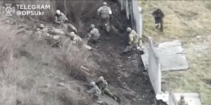 Footage of Russian soldiers in a crossfire with Ukrainian forces.