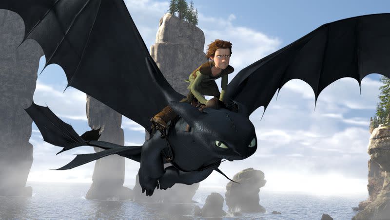 In this file film publicity image released by Paramount Pictures, Hiccup, voiced by Jay Baruchel, rides Toothless in a scene from “How to Train Your Dragon.” 