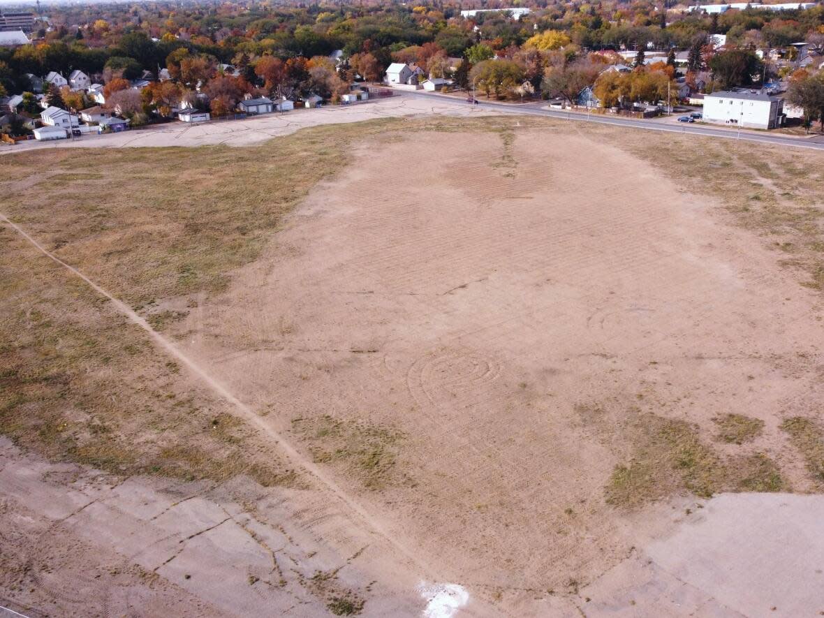 The site of the former Taylor Field in Regina, Sask., remains an empty dirt field more than five years after the football stadium was torn down. (Cory Herperger/Radio-Canada - image credit)