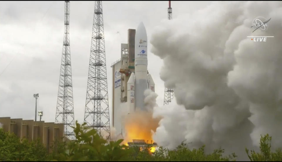 In this image released by NASA, Arianespace's Ariane 5 rocket with NASA's James Webb Space Telescope onboard, lifts off Saturday, Dec. 25, 2021, at Europe's Spaceport, the Guiana Space Center in Kourou, French Guiana. The $10 billion infrared observatory is intended as the successor to the aging Hubble Space Telescope. (NASA via AP)