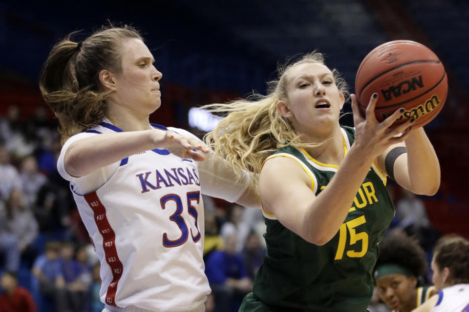 Baylor forward Lauren Cox (15) pulls in a rebound next to Kansas center Bailey Helgren (35) during the second half of an NCAA college basketball game in Lawrence, Kan., Wednesday, Jan. 15, 2020. (AP Photo/Orlin Wagner)