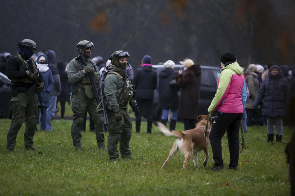 Belarusian riot police stand to block demonstrators during an opposition rally to protest the official presidential election results in Minsk, Belarus, Sunday, Nov. 22, 2020. The Belarusian human rights group Viasna says more than 140 people have been arrested and many of them beaten by police during protests calling for the country's authoritarian president to resign. The demonstrations that attracted thousands were the 16th consecutive Sunday of large protests against President Alexander Lukashenko. (AP Photo)