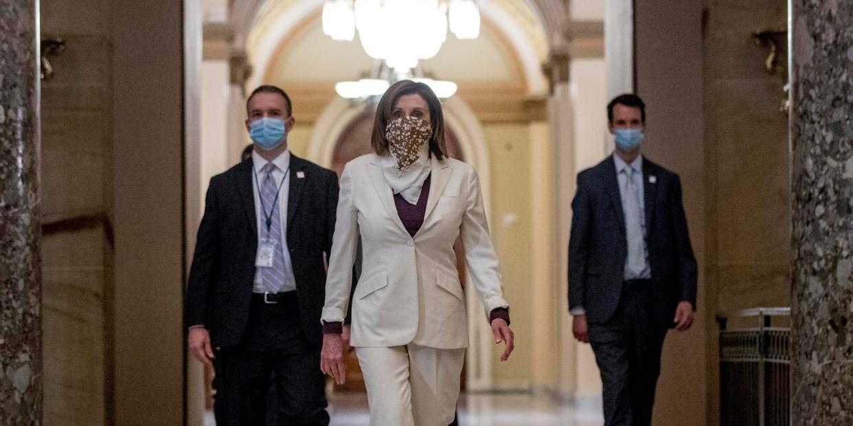 FILE - In this April 23, 2020, file photo House Speaker Nancy Pelosi of Calif., walks to her office after signing the Paycheck Protection Program and Health Care Enhancement Act, H.R. 266, after it passed the House on Capitol Hill in Washington. Pelosi shelved a proposal for proxy voting this week after Republicans objected. (AP Photo/Andrew Harnik, File)