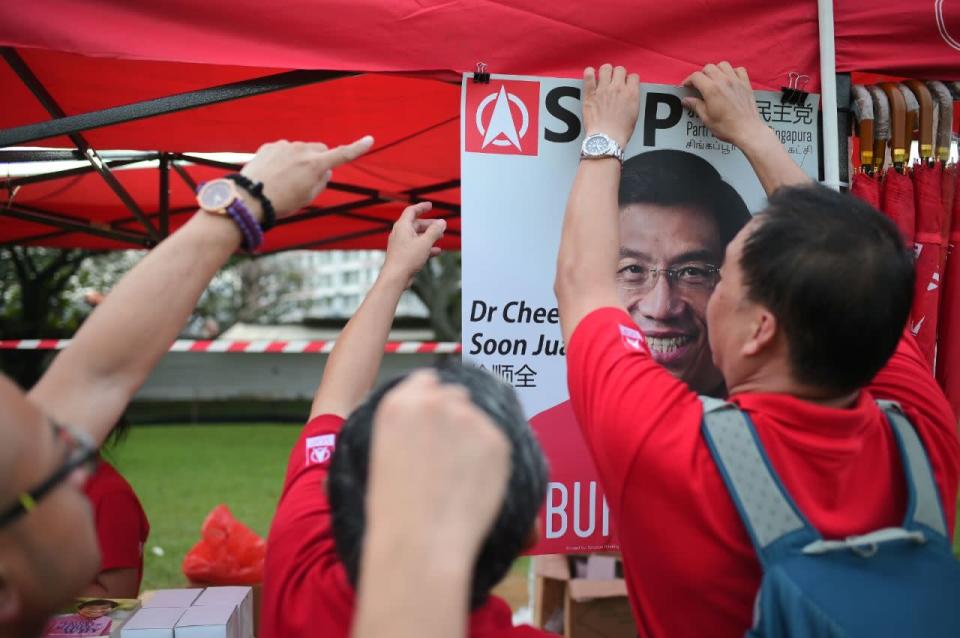 Volunteers setting up merchandise booths. (Photo: Joseph Nair)