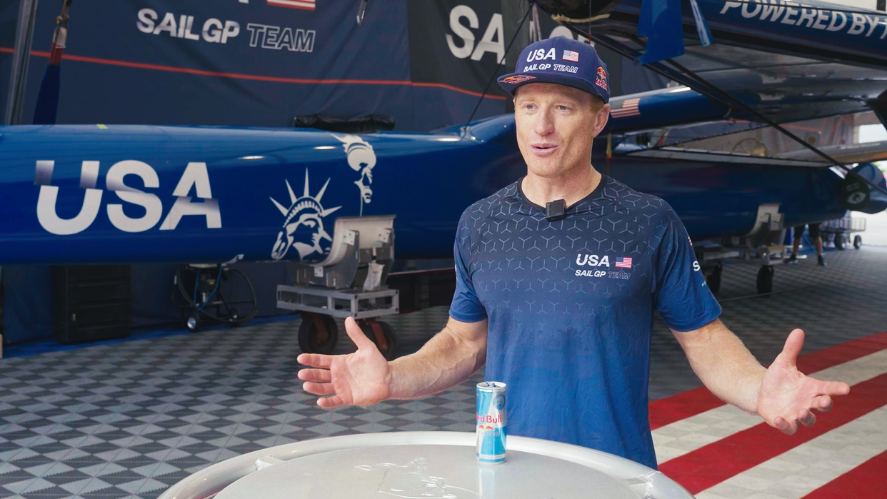 Jimmy Spithill stands in front of a United States SailGP sailboat