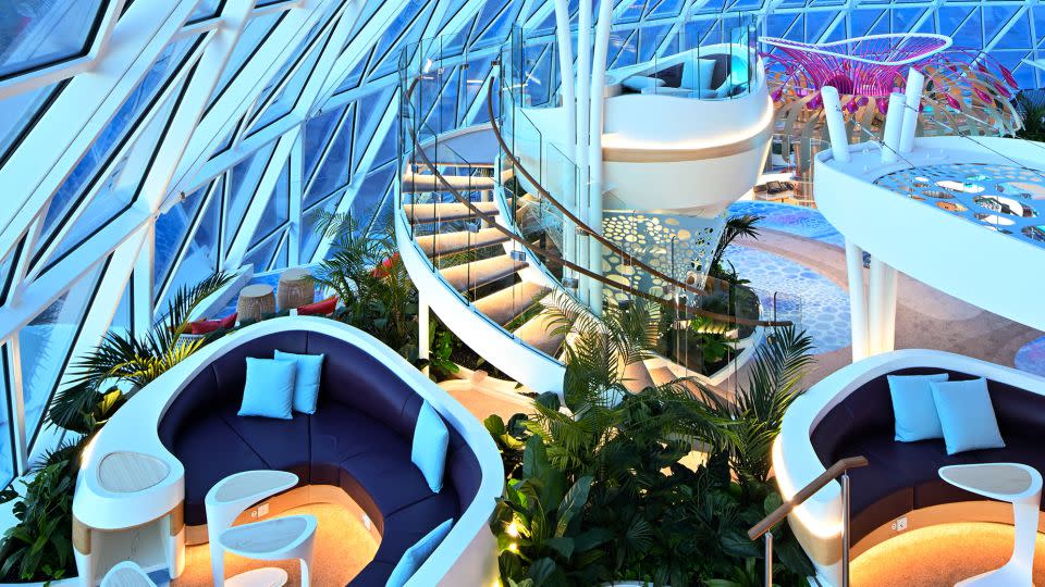 The Overlook Lounge, located inside the 82-foot-tall steel and glass AquaDome that crowns part of the top of the ship, has elevated seating pods. - Michael Verdure/Royal Caribbean International