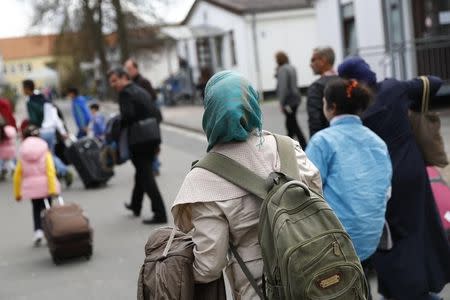 Syrian refugees arrive at the camp for refugees and migrants in Friedland, Germany April 4, 2016. REUTERS/Kai Pfaffenbach