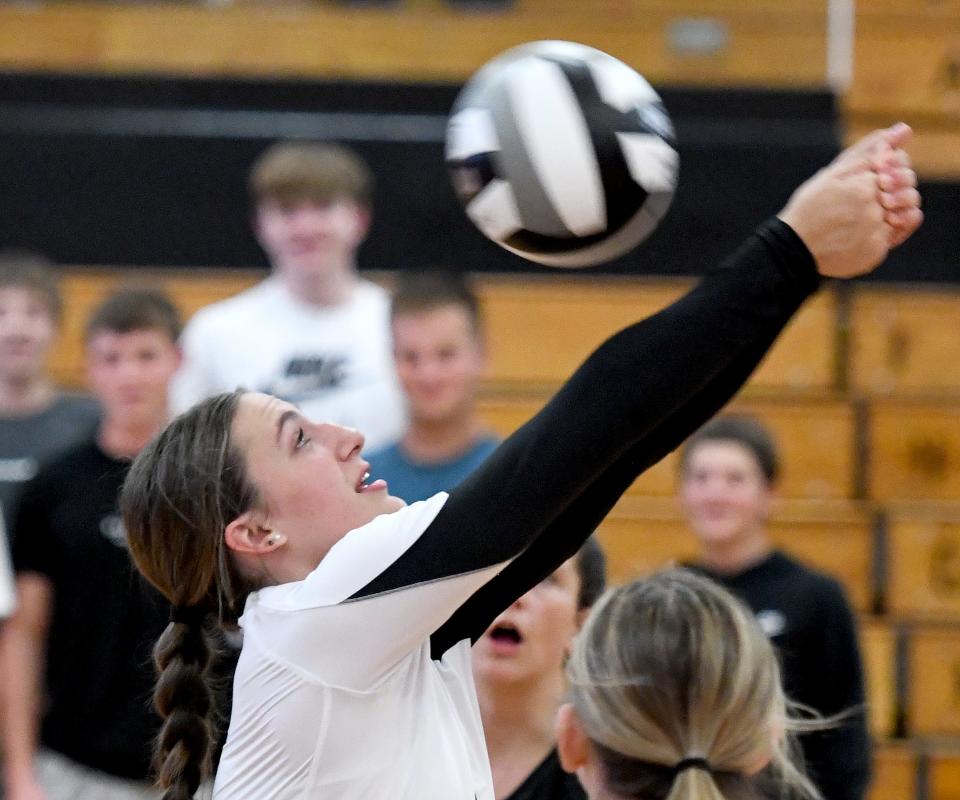 Perry's Elaine Laubacher hits the ball during the third set of Tuesday's match against Green.