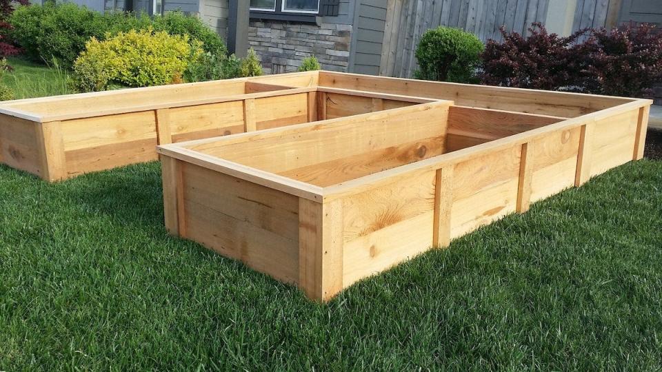 U-Shaped raised garden bed made of cedar, not filled with soil.