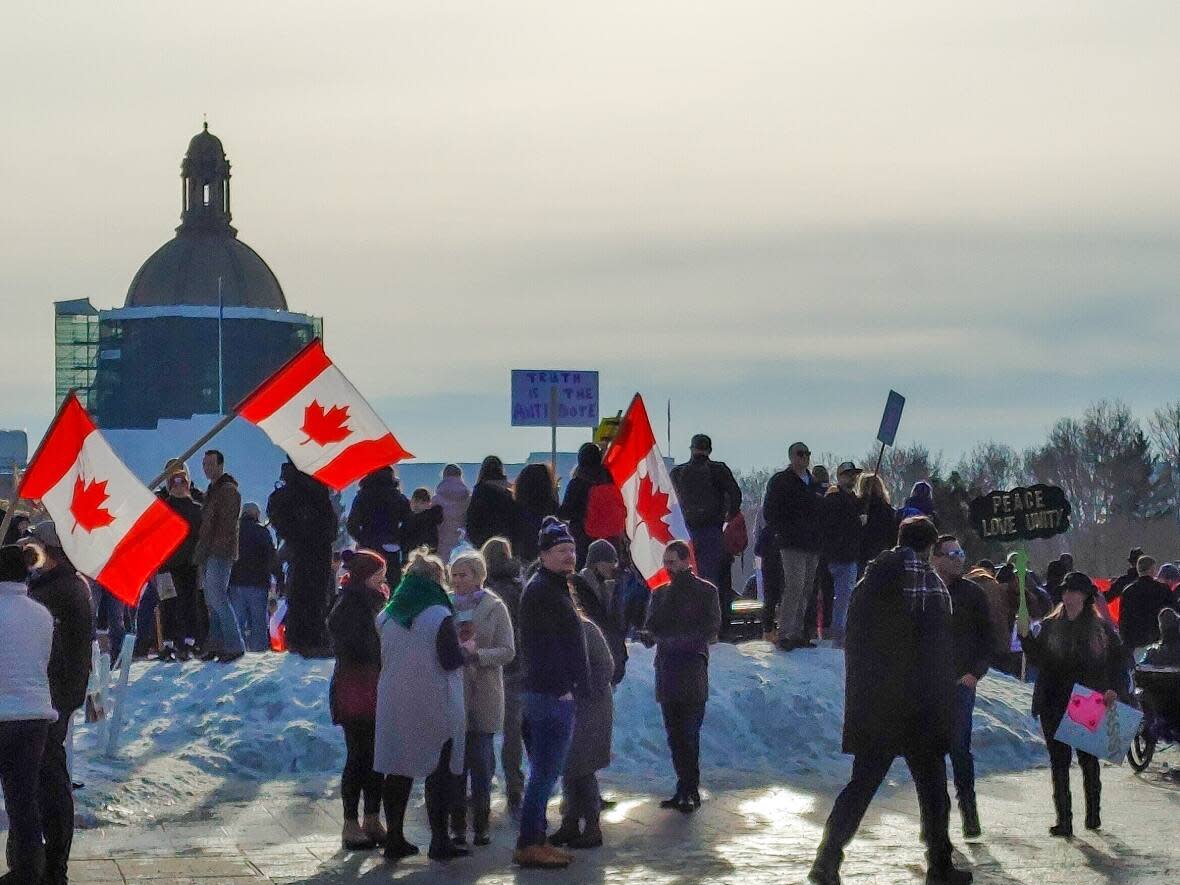 A huge crowd converged on the Alberta Legislature grounds Saturday as part of a convoy to show local support for a national anti-vaccine-mandate trucker convoy protest on Parliament Hill in Ottawa. (Nicholas Frew/CBC - image credit)