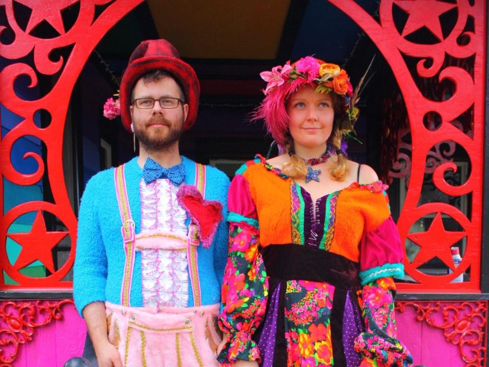 Kat O'Sullivan and her partner, Mason Brown, standing outside their colorful Hudson Valley home.