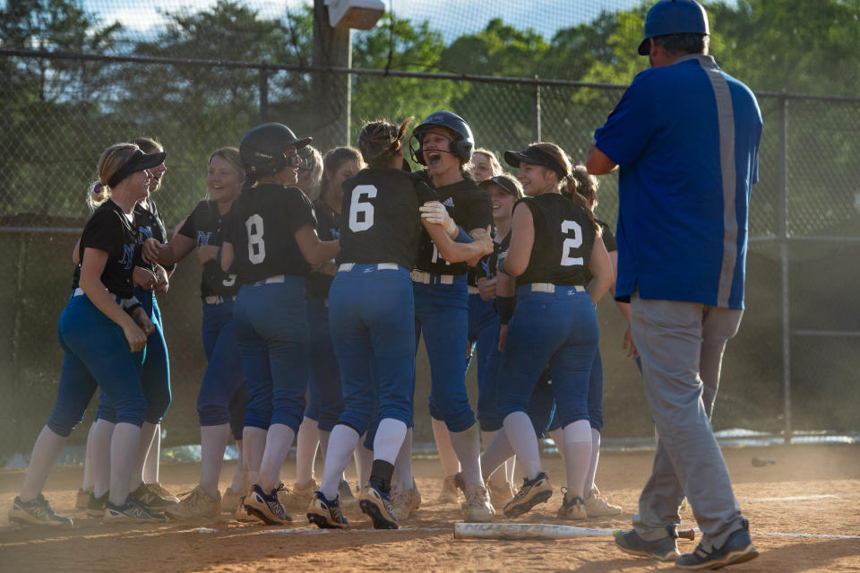 North Lincoln celebrates Ellie Rinkus' (14) home run off Pickens on May 12, 2022. Rinkus said her teammates thought the ball must have bounced over the fence, because a longball was so improbable.