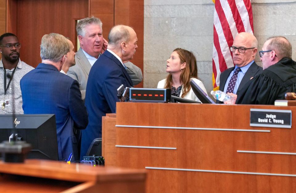 Special prosecutors and defense attorneys gather before Franklin County Common Pleas Court Judge David Young on Wednesday, Feb, 7, 2024, for a sidebar discussion during the trial of former county sheriff's deputy Jason Meade on murder charges in the Dec. 4, 2020, shooting death of 23-year-old Casey Goodson Jr.