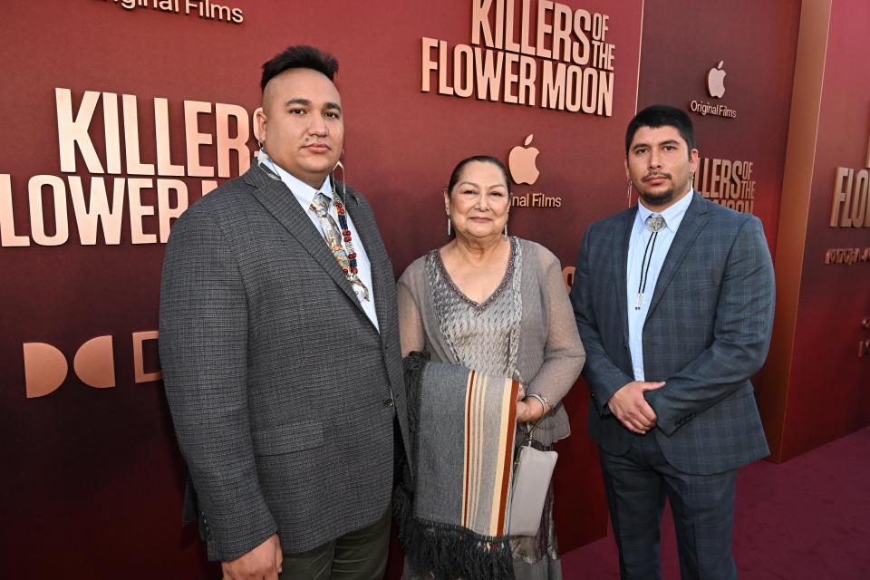 From left, Christopher Cote, Janis Carpenter and Braxton Redeagle attend the Oct. 16 Los Angeles premiere of Apple Original Films' "Killers of the Flower Moon" at Dolby Theatre.